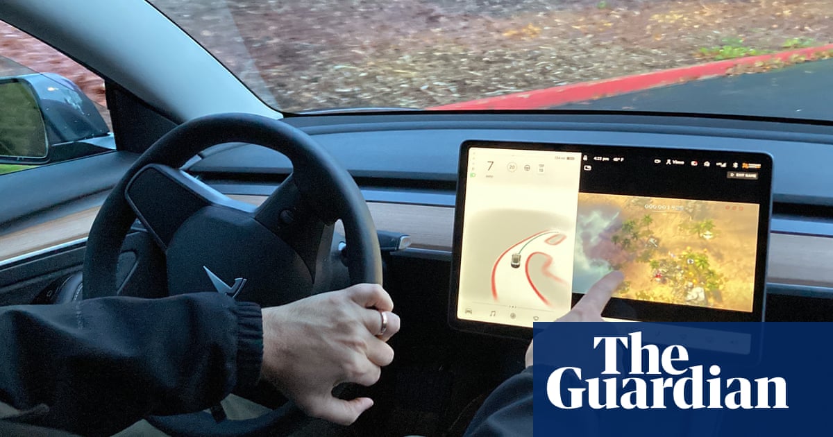 Tesla bows to pressure, stops allowing drivers to play video games while driving